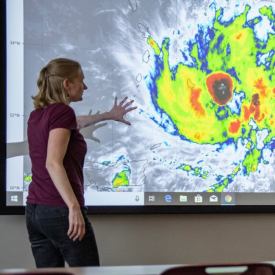 Kim Wood delivering a briefing on (then) Tropical Storm Dorian